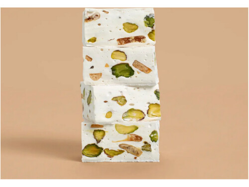 - 1701 Pistachio and Salted Caramel Honey Nougat pieces close‑up