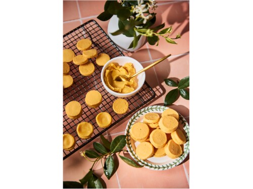 Custard sandwich biscuits arranged for serving