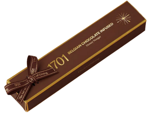 1701 Belgian Chocolate Infused Honey Nougat Bar 100g, hand‑wrapped with ribbon, showing smooth Belgian chocolate nougat texture in a premium South African artisanal presentation.