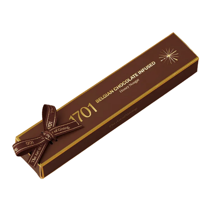1701 Belgian Chocolate Infused Honey Nougat Bar 100g, hand‑wrapped with ribbon, showing smooth Belgian chocolate nougat texture in a premium South African artisanal presentation.